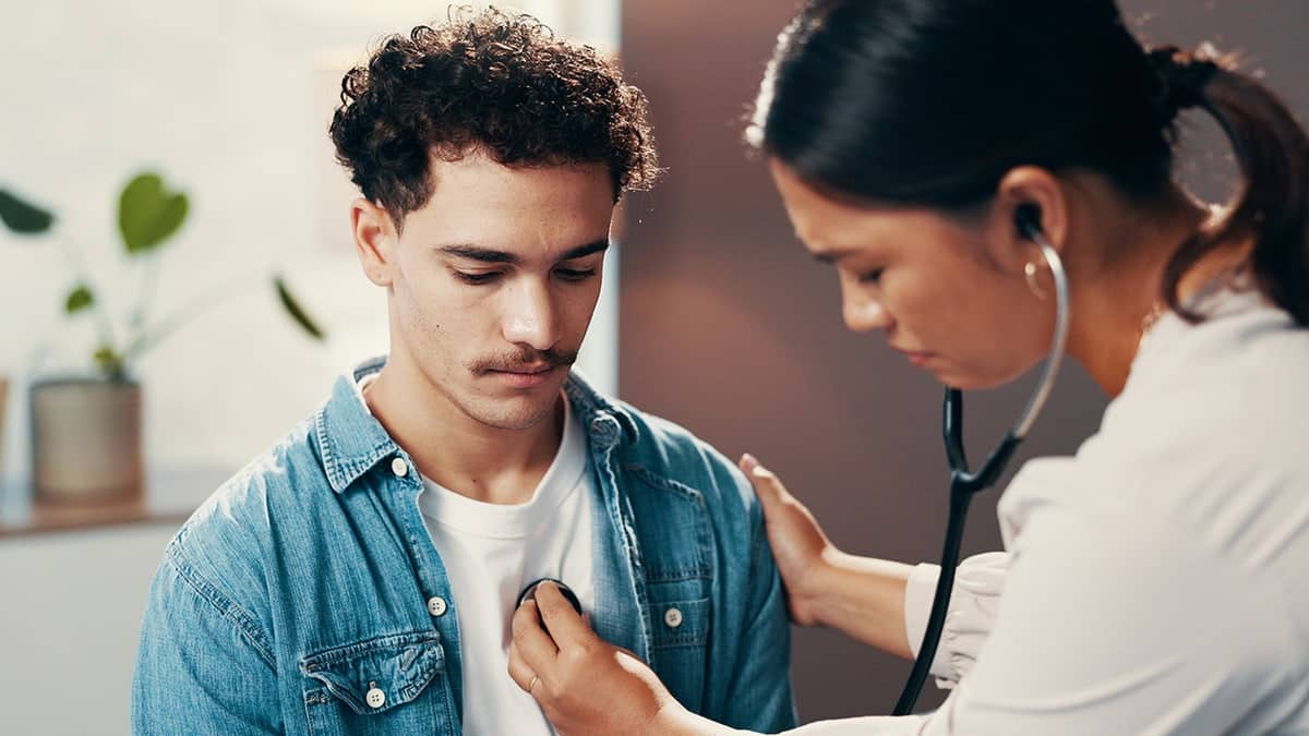 man having heart checked by doctor